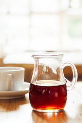 A Cup of Coffee on the Wooden Table in Modern Hipster Cosy Cafeteria