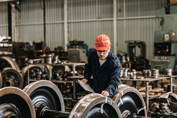 Man working at train factory.