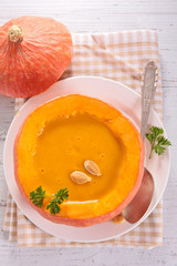 pumpkin soup in pumpkin bowl, top view