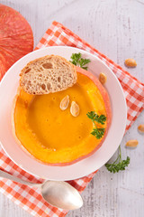 pumpkin soup in pumpkin bowl, top view