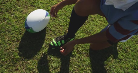 Young adult female rugby player on a rugby pitch