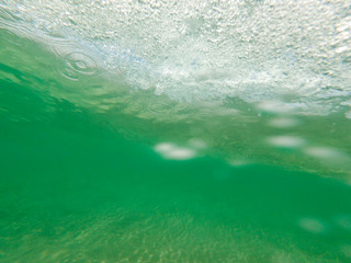 Fototapeta na wymiar Bubbles under the water of a river