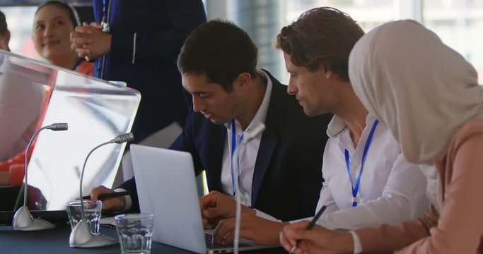 Business delegates talking at a conference