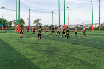 Obraz premium Blurred image for background of kids are training and playing soccer football.