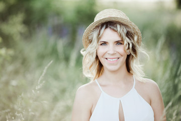 a beautiful woman portrait among greenery lawn