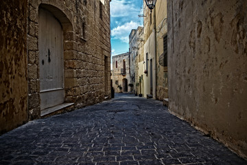 Narrow Street with High Surrounding Walls