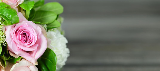 Mothers Day background. Bouquet of flowers on wooden background with copy space