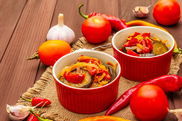 Marinated salad with pickled vegetables: eggplant, carrot, pepper, tomato, garlic