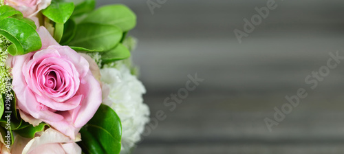 Mothers Day background. Bouquet of flowers on wooden background with copy space