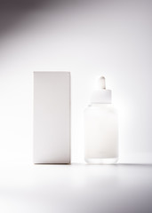 White glass cosmetic bottle mock-up with blank copy space