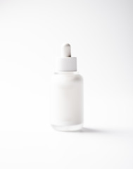 White glass cosmetic bottle mock-up with blank copy space