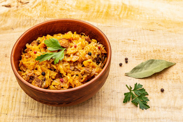 Stewed (braised) cabbage served on ethnic ceramic bowl