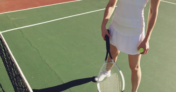 Woman playing tennis on a sunny day