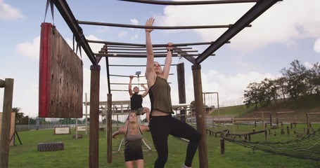 Young adults training at an outdoor gym bootcamp - Powered by Adobe