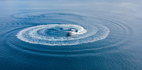 Fototapeta na wymiar Aerial view of speed motor boat on open sea