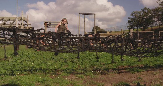 Young adults training at an outdoor gym bootcamp