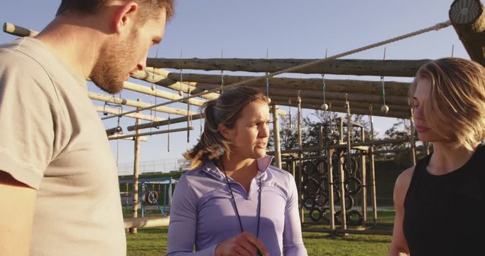 Young adults training at an outdoor gym bootcamp