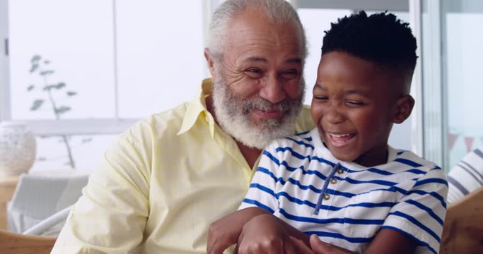 Mature man enjoying time with his grandson