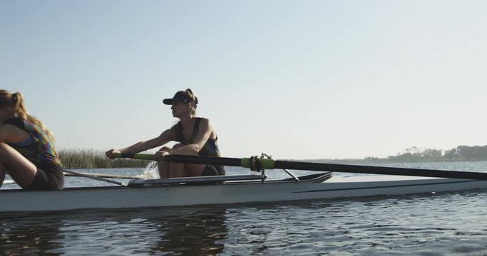 Female rowers training on a river