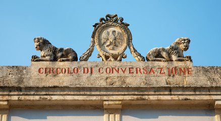 Old baroque sign in Ragusa Ibla, Sicily. The meaning is "Conversation Club".