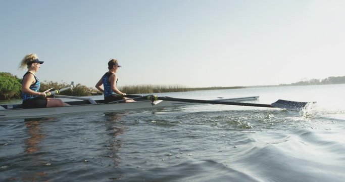 Female rowers training on a river