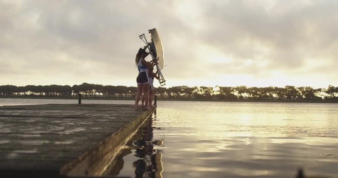 Female rowing team training on a river