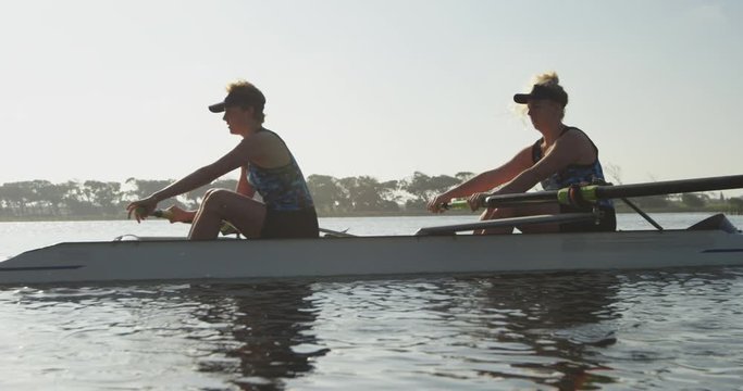 Female rowers training on a river