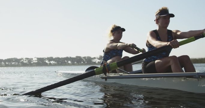 Female rowers training on a river