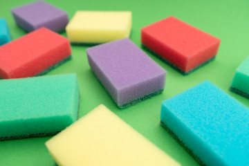 sponges for dishwashing isolated on green background