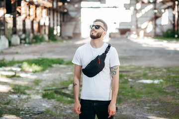 Stylish bearded man with waist bag