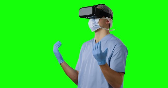 Young surgeon in scrubs and VR headset