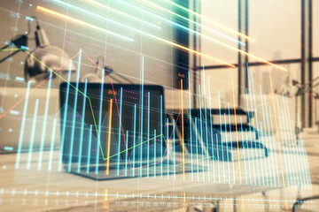 Forex graph hologram with desktop office computer background. Double exposure. Concept of financial analysis.