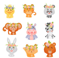 Obraz premium Set of cute animals with flowers on their heads. Vector illustration on a white background.