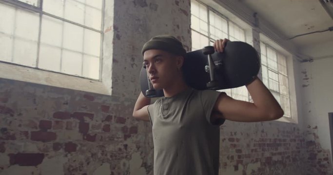 Fashionable young man in an abandoned warehouse