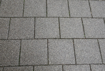 Obraz premium Gray pebble pavement. Texture. Background.