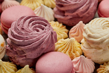 Pink and white zephyr with small yellow and pink meringues and pink french macaroons