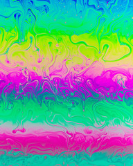 A creative abstract swirling liquid rainbow of colours that looks like watercolour paints or inks that makes an interesting vibrant layered background