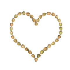 Buckwheat arranged in heart shape and isolated on white background