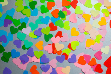 Paper rainbow colors hearts as a pattern for design