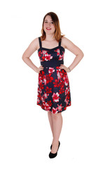 Pretty woman standing in colorful dress