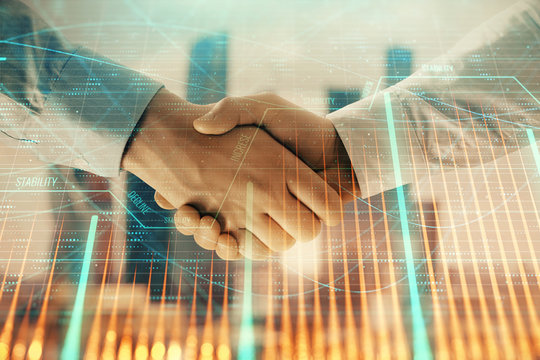Double exposure of financial graph on cityscape background with two businessman handshake. Concept of stock market deal