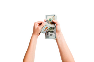 Top view of female hands counting dollar banknotes on white isolated background. Investment and...