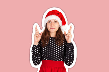 woman keeps hands raised, fingers crossed and dreams about something. Magazine collage style with trendy color background. holiday concept