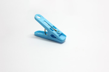 plastic​ clothespins blue​ color​​ isolated​ on​ white​ background.