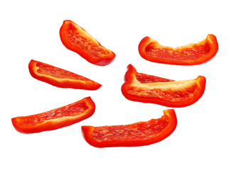 Cut slices of red sweet bell pepper isolated on white background.Clipping Path