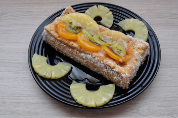 Delicious dessert of puff pastry and fruits on a table