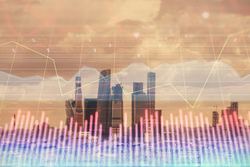 Double exposure of financial graph on downtown veiw background. Concept of stock market research and analysis