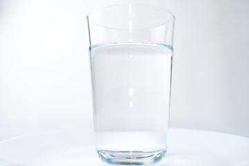 water glass isolated on a blue background