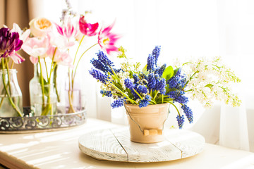 Bunch of grape hyacinths in a ceramic vase