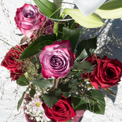Flower bouquet with Red Naomi roses, Lilium Longiflorum, Chrysanthemum Santini, grasses, gypsophila and Deep Purple roses.